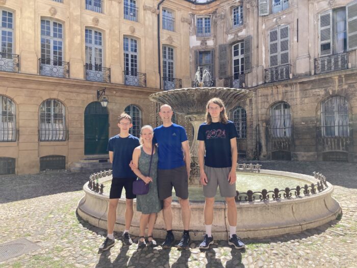 family in front of fountain in Aix en Provence, France